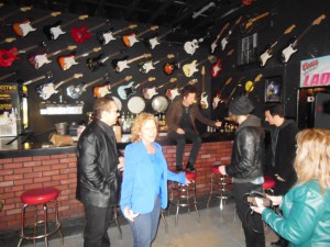 Willie Nile sitting on a Stone Pony bar with a thousand guitars behind him before Light of Day